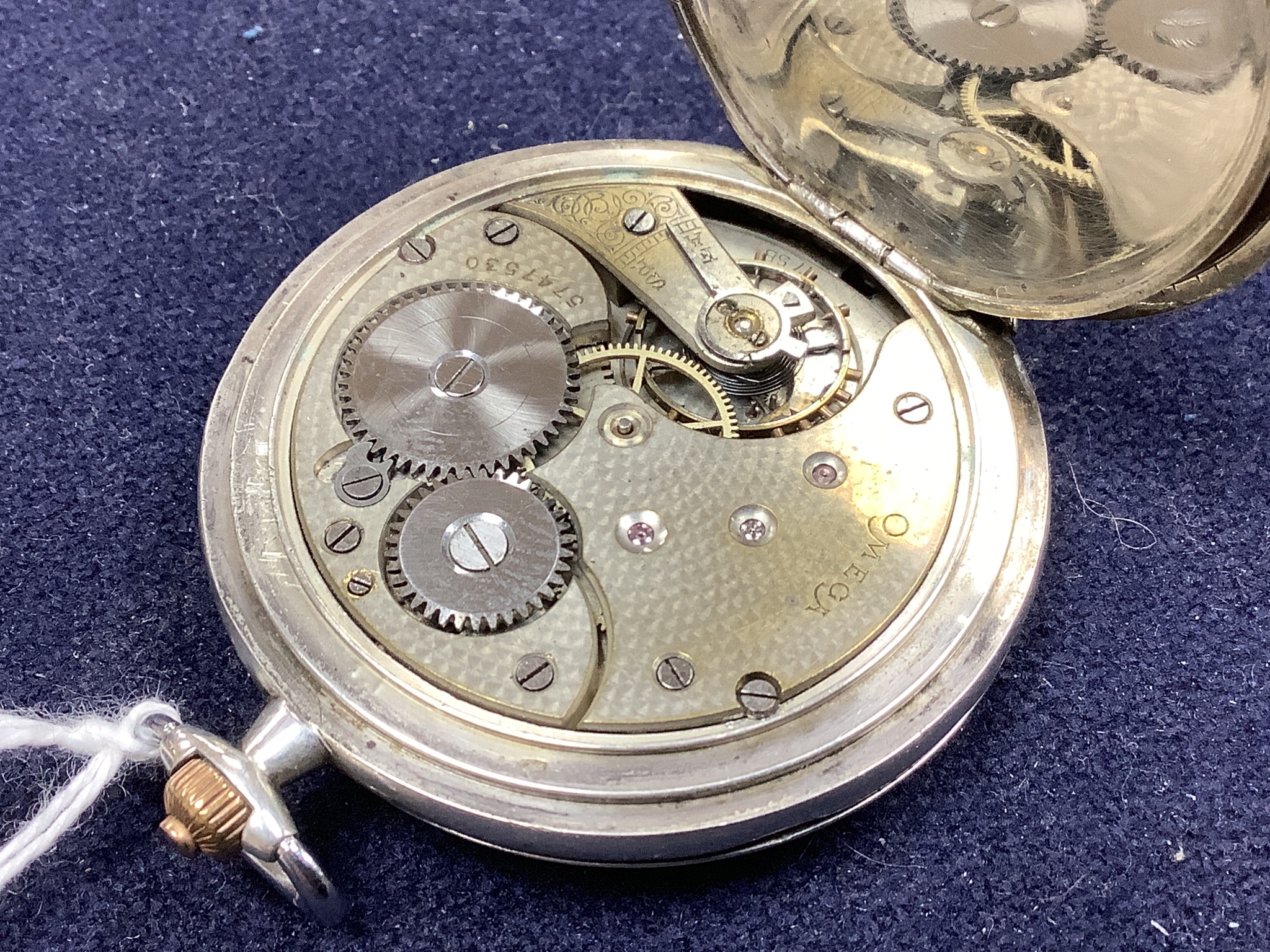 An Omega keyless silver hunter pocket watch in 900 standard case, lid associated.